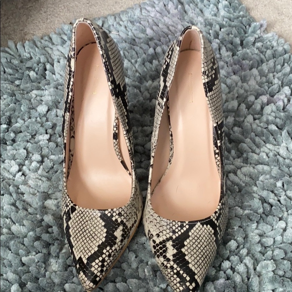 Black and cream heels runs big